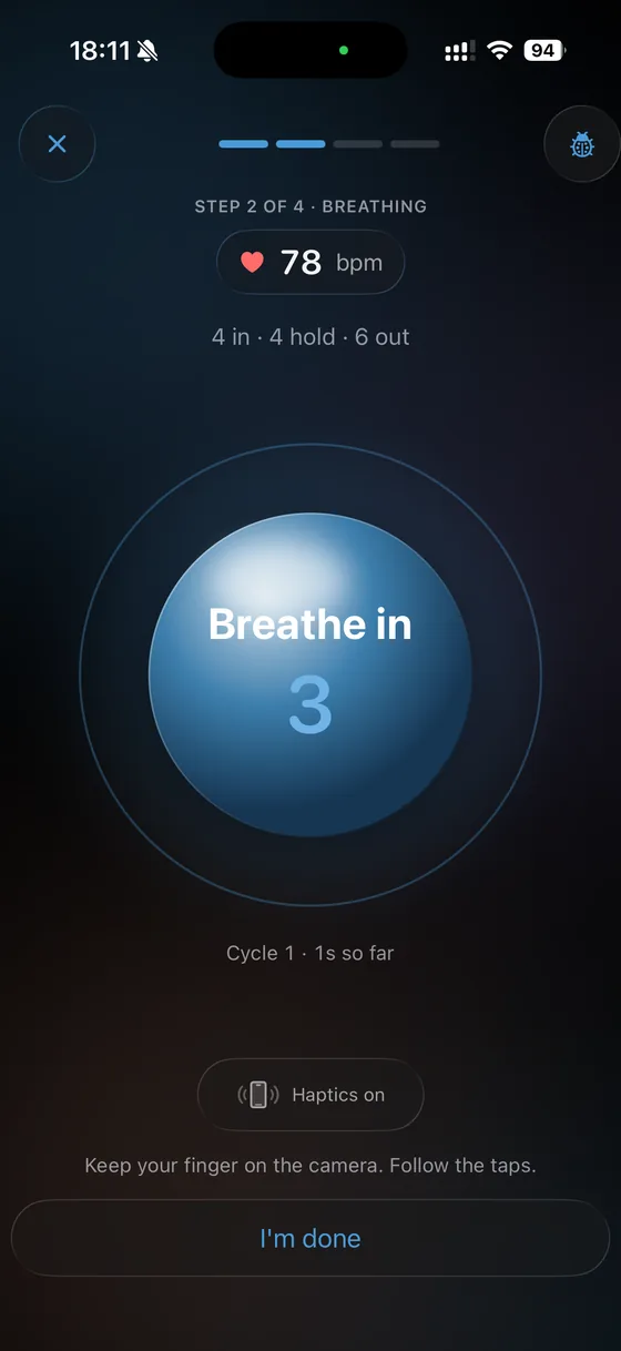 The breathing screen: a large blue orb reading Breathe in with a countdown, the pulse shown small at the top.